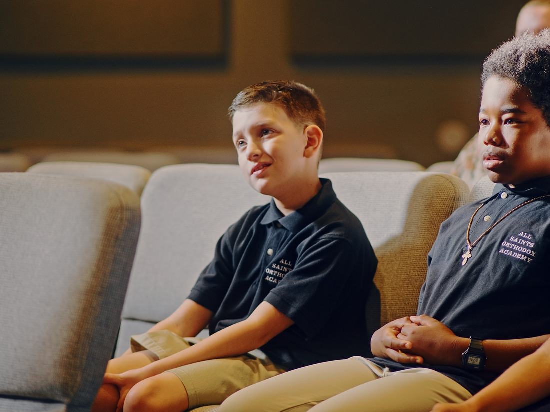 Students seated together in the pews