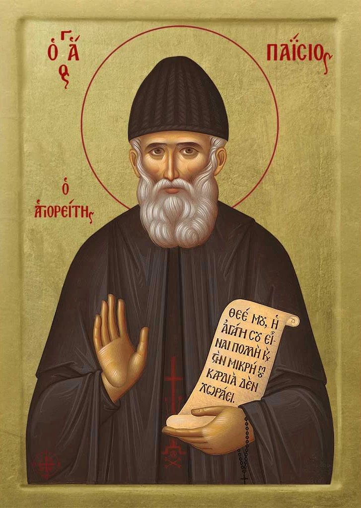 Icon of St. Paisios of Mount Athos in monastic dress, blessing with his right hand and holding a scroll